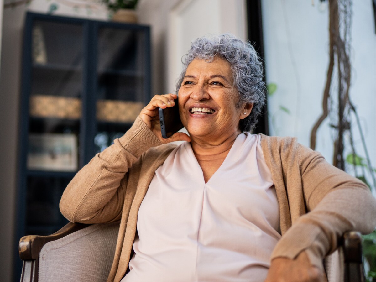 Smiling woman speaking on a phone